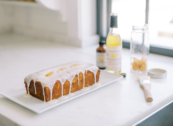 Picture of pound cake on cooling rack covered in Meyer Lemon Simple Syrup Icing