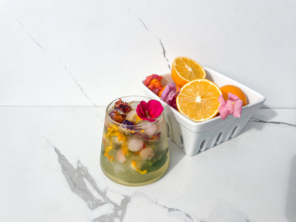 Meyer Lemon Mojito cocktail with edible flower ice cubes