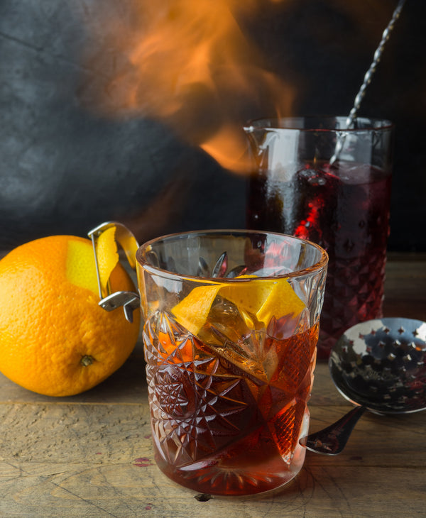 Photo of Spiced Pumpkin Old Fashioned Cocktail with an Orange for Garnish