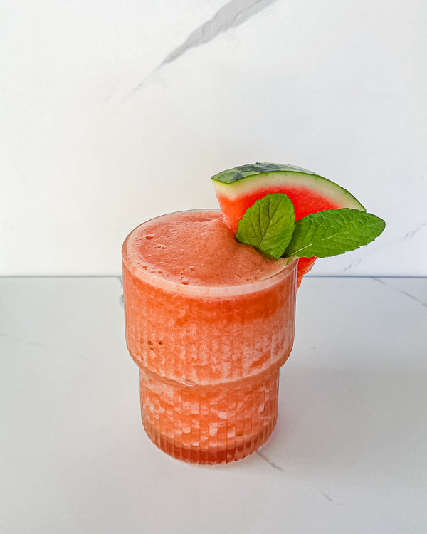 Watermelon Mint Frose topped with a slice of watermelon and fresh mint