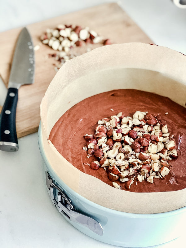 Photo of Flourless Chocolate Cake Dessert in Pan with Chopped Almonds