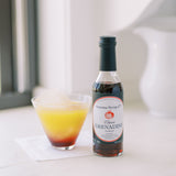 Picture of Classic Grenadine Syrup next to Sonoma Tequila cocktail recipe