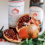 Fresh pomegranates with simple syrup